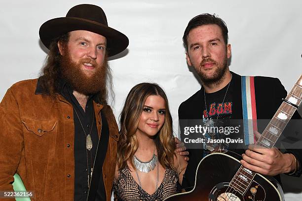 John Osborne of the Brothers Osborne, Maren Morris, and T.J. Osborne of the Brothers Osborne backstage at the AIMP Nashville Awards on April 18, 2016...