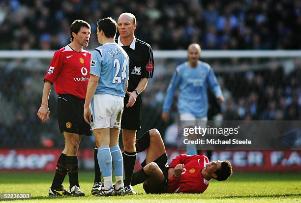 Roy Keane of Manchester United clashes with Joey Barton of Manchester City during the Barclays Premiership match between Manchester City and...