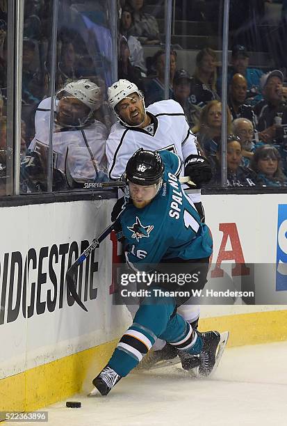 Nick Spaling of the San Jose Sharks skating for control of the puck, collides with Jamie McBain of the Los Angeles Kings in the second period in Game...