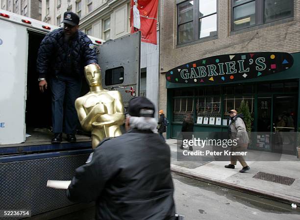 Brinks armed gaurds Ismael Suren and Tyrone Woods deliver Oscar statues to Gabriel's in preparation for their New York Oscar night celebration on...