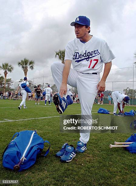 Los Angeles Dodgers pitcher Kazuhisa Ishii from Japan puts on his shoes before a practice session at their Spring Training center 24 February 2005 in...