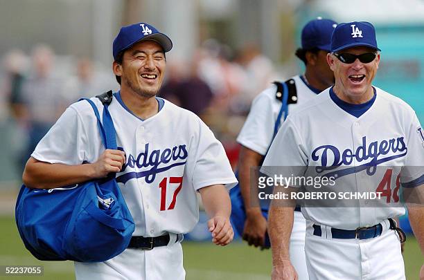 Los Angeles Dodgers pitcher Kazuhisa Ishii of Japan laughs before a practice session at their Spring Training center in Vero Beach, Florida, 24...