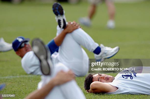 Los Angeles Dodgers pitcher Kazuhisa Ishii of Japan stretches before a practice session at their Spring Training center in Vero Beach, Florida, 24...