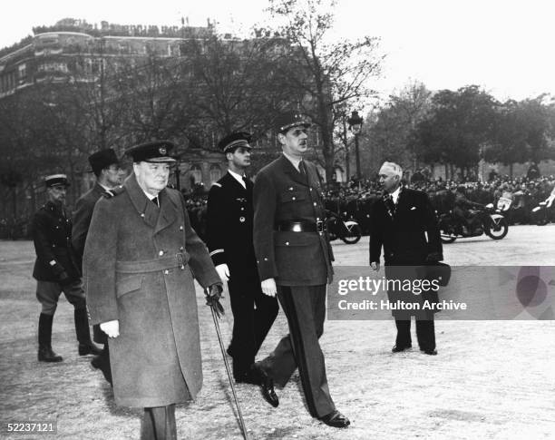 British Prime Minister Winston Churchill and French general Charles de Gaulle walk down the Champs Elysees during Churchill's visit, Paris, November...