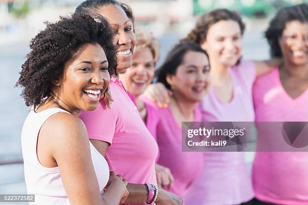 mothers and daughters for breast cancer awareness - pink october stock pictures, royalty-free photos & images