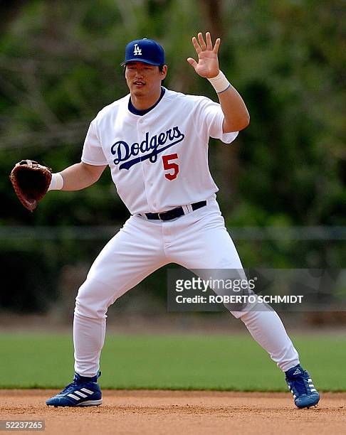 Los Angeles Dodgers infielder Hee-Seop Choi of South Korea runs drills during a practice session at team's Spring Training center in Vero Beach,...