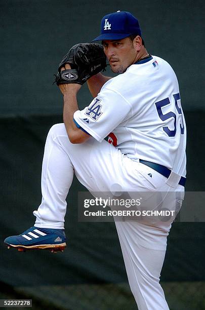 Los Angeles Dodgers pitcher Giovanni Carrara of Venezuela practices a delivery during a practice session at team's Spring Training center in Vero...