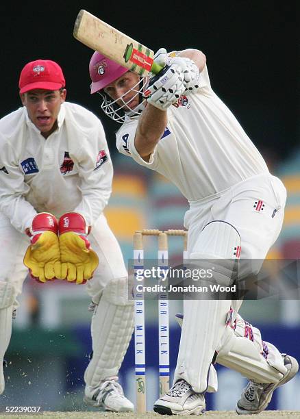 Wade Seccombe of the Bulls hits out during day 2 of the Pura Cup match between the Queensland Bulls and South Australia Redbacks at the Gabba,...