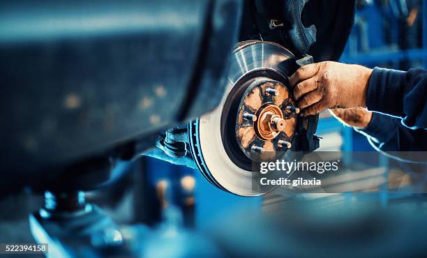car service procedure. - mechanics work stockfoto's en -beelden