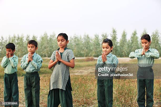 praying hands - saying grace stock pictures, royalty-free photos & images