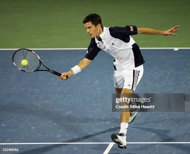 Tim Henman of Great Britain plays a volley during his quarter-final match against Ivan Ljubicic of Croatia at the Dubai Duty Free Men's Open Tennis...