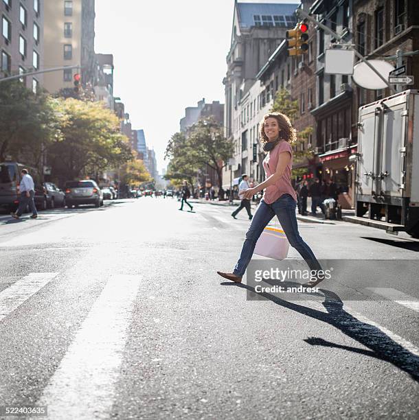 woman in new york city - crossing road stock pictures, royalty-free photos & images