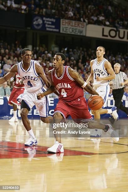 Bracey Wright of the Indiana Hoosiers moves the ball against Rajon Rondo of the Kentucky Wildcats during the game at Freedom Hall on December 11,...