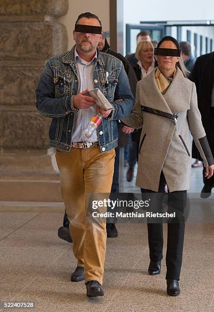 Lutz Bachmann, wearing black glasses, founder of the Pegida movement, and his wife Vicky, arrives for the first day of his trial to face charges of...