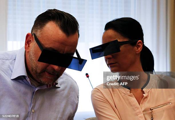 Lutz Bachmann , founder of Germany's xenophobic and anti-Islamic PEGIDA movement , and his wife Vicky have their eyes covered as if pixelized by...