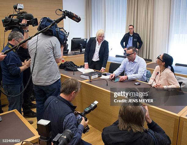 Lutz Bachmann , founder of Germany's xenophobic and anti-Islamic PEGIDA movement waits waits together with his lawyer Katja Reichel and his wife...