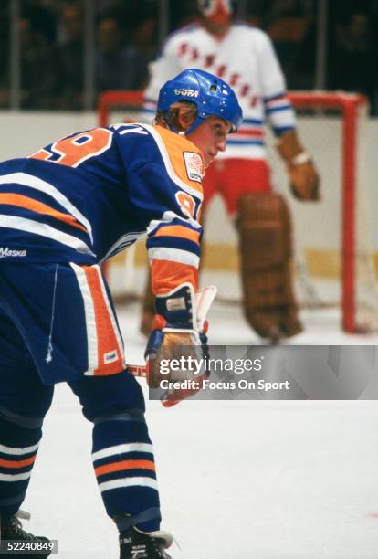 The Edmonton Oilers' center Wayne Gretzky watches for the next play during a circa 1980s game against the New York Rangers at Madison Square Garden...