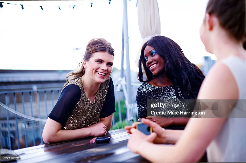 Women laughing in rooftop garden