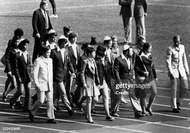 Members of the Israeli team march on the field of the Munich Olympic stadium on September 06, 1972 to attend the memorial ceremony paying tribute to...