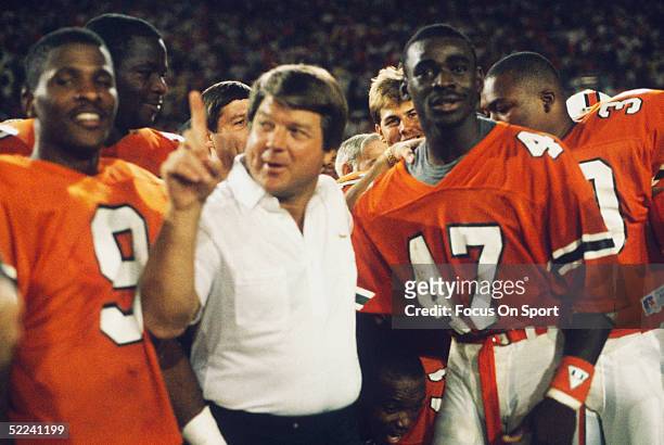 University of Miami Hurricanes head coach Jimmy Johnson celebrates with Michael Irvin following the game against the Notre Dame Fighting Irish at the...