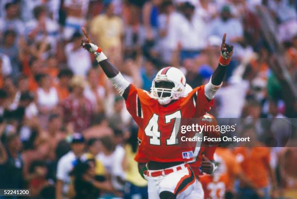 Michael Irvin of the Miami Hurricanes celebrates against the Notre Dame Fighting Irish at the Orange Bowl on November 28, 1987 in Miami, Florida. The...