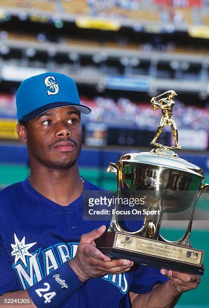 Seattle Mariners' Ken Griffey Jr. #24 holds a trophy after winning the 1994 All Star Home Run Derby with a total of seven home runs at Three Rivers...