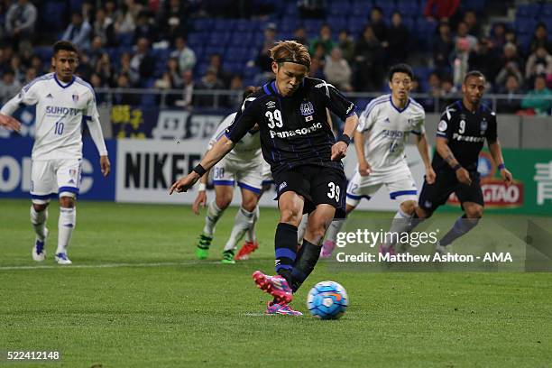 Takashi Usami of Gamba Osaka takes a penalty but sees it saved in the first half during the AFC Champions League Group G match between Gamba Osaka...