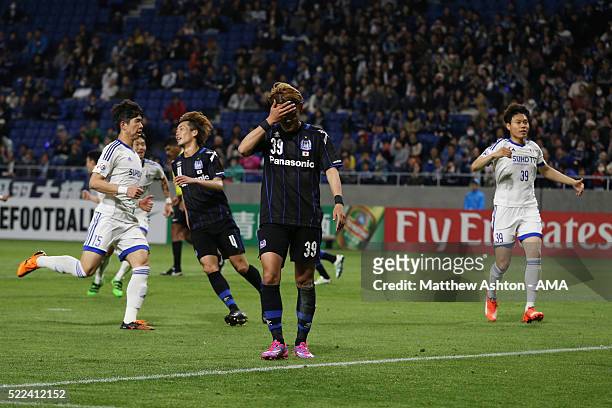 Takashi Usami of Gamba Osaka reacts after his first half penalty is saved during the AFC Champions League Group G match between Gamba Osaka and Suwon...