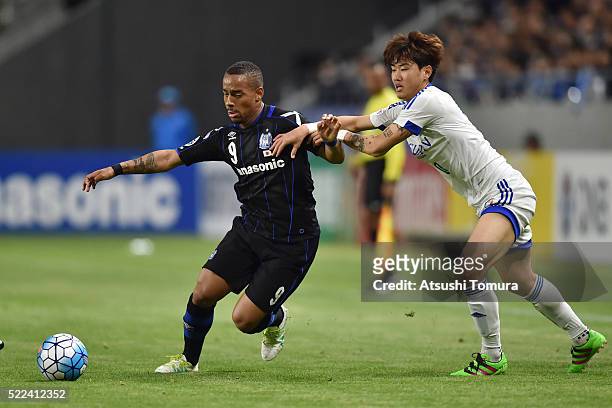 Ademilson Braga Bispo Junior of Gamba Osaka runs with the ball during the AFC Champions League Group G match between Gamba Osaka and Suwon Samsung...