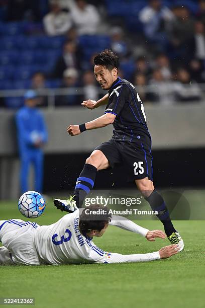 Jungo Fujimoto of Gamba Osaka kicks the ball during the AFC Champions League Group G match between Gamba Osaka and Suwon Samsung Blue Wings at the...