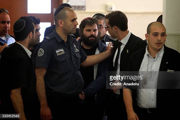 Yosef Haim Ben David, who is convicted of beating and burning alive of the Palestinian teenager Mohammed Abu Khdeir in 2014, is led to the courtroom...