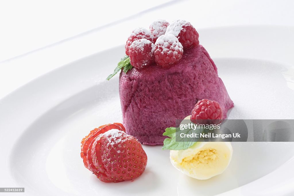 Raspberry souffle sponge plated dessert