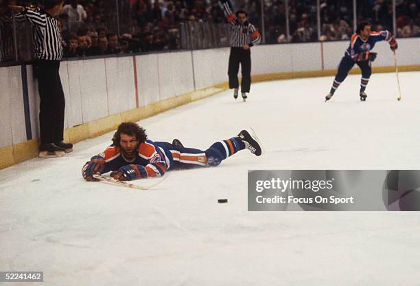 Dave Semenko of the Edmonton Oilers falls to the ice during an 1984 Stanley Cup Finals game against the New York Islanders in May, 1984 at the Nassau...