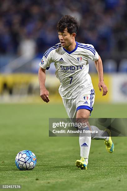 Lee Sang-Ho of Suwon Samsung Bluewings FC runs with the ball during the AFC Champions League Group G match between Gamba Osaka and Suwon Samsung Blue...