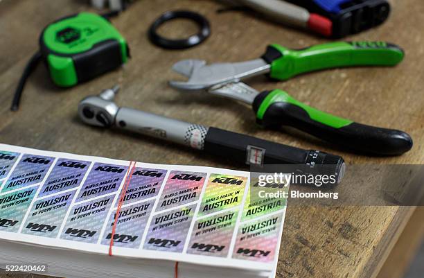 Made in Austria holographic decals sit on a workbench inside the KTM Fahrrad GmbH bicycle manufacturing facility, in Mattighofen, Austria, on...