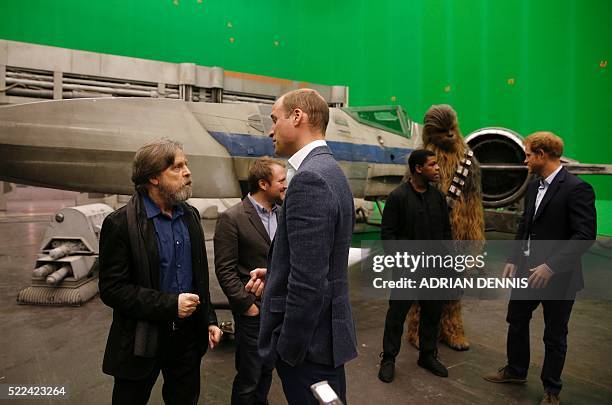 Britain's Prince William , Duke of Cambridge speaks with US actor Mark Hamill as Prince Harry speaks with British actor John Boyega during a visit to...