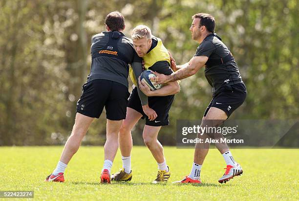 Alex Goode, Baden Kerr and Neil De Kock of Saracens during the Saracens media session at Old Albanian Rugby Football Club on April 19, 2016 in St...