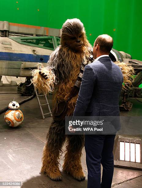 Prince William, Duke of Cambridge talks with Chewbacca during a tour of the Star Wars sets at Pinewood studios on April 19, 2016 in Iver Heath,...