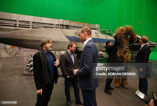 Britain's Prince William , Duke of Cambridge speaks with US actor Mark Hamill as Prince Harry speaks with British actor John Boyega during a visit to...