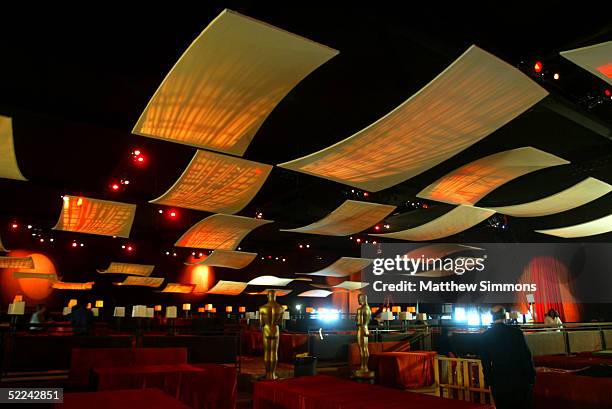 The lighting and place setting's for the tables are installed in the Grand Ballroom during preparations for the 77th Academy Awards at the Kodak...