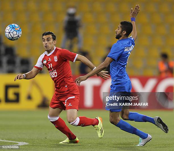 Tractorsazi Tabriz' Bakhtiar Rahmani vies for the ball with Al-Hilal's Salma al-Faraj during their AFC Champions League group stage football match in...