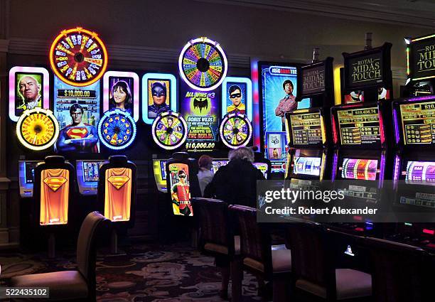 Tourists gamble at an array of slot machines at the Bellagio hotel and casino located along the Las Vegas Strip in Las Vegas, Nevada. The luxury...