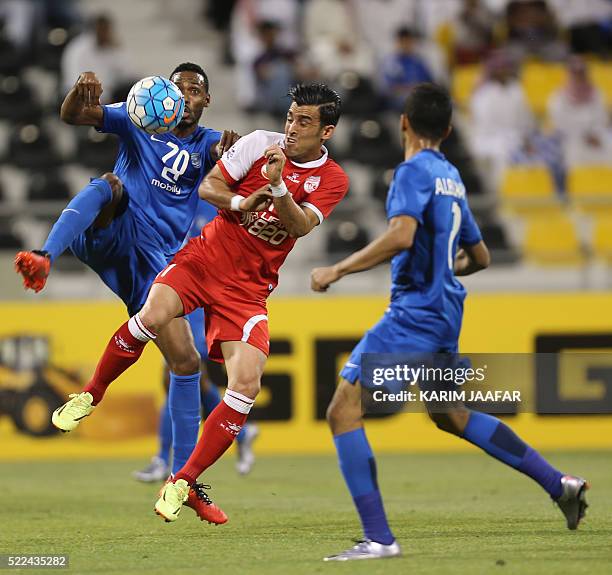 Tractorsazi Tabriz' Bakhtiar Rahmani vies for the ball with Al-Hilal's Mohammed al-Burayk and Mohammed Jahfali during their AFC Champions League...