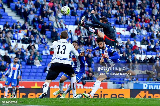 Iago Aspas of RC Celta de Vigo scores the opening goal past Alvaro Gonzalez Antonio Raillo and Pau Lopez of RCD Espanyol during the La Liga match...