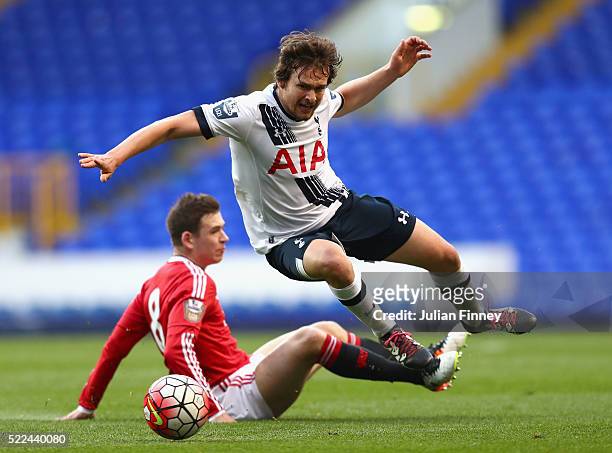 Filip Lesniak of Spurs is fouled by Donald Love of Man Utd during the U21 Barclays Premier League match between Tottenham Hotspur and Manchester...