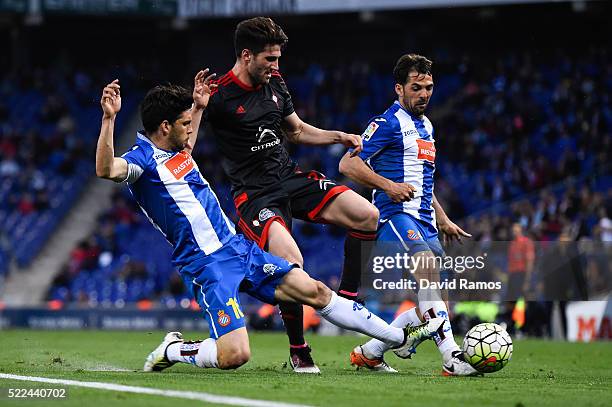 Carles Planas of RC Celta de Vigo competes for the ball with Javi Lopez and Victor Sanchez of RCD Espanyol during the La Liga match between Real CD...