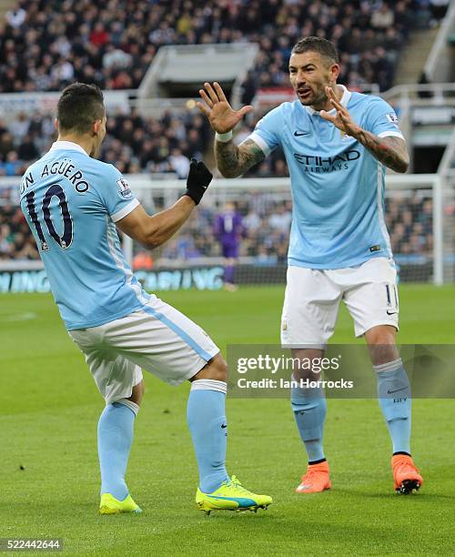 Sergio Aguero of Manchester City celebrates scoring the opening goal with Aleksandar Kolarov during the Barclays Premier League match between...