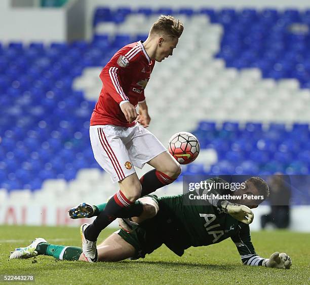 Scott McTominay of Manchester United U21s in action with Luke McGee of Tottenham Hotspur U21s during the Barclays U21 Premier League match between...