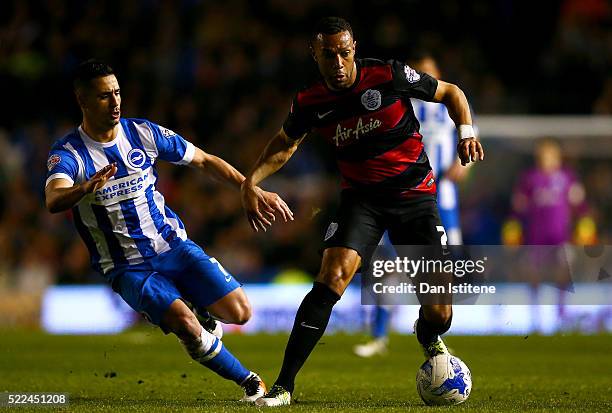 Matt Phillips of Queens Park Rangers runs with the ball under pressure from Beram Kayal of Brighton & Hove Albion during the Sky Bet Championship...