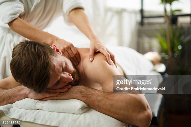back massage at the spa - massage bildbanksfoton och bilder